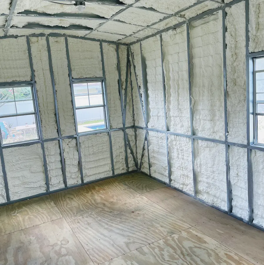 Closed-cell spray foam insulation applied to wall cavities in a residential project in Superior